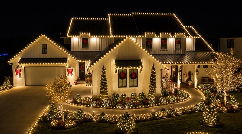 Warm white Christmas lights on farmhouse — Louisville KY